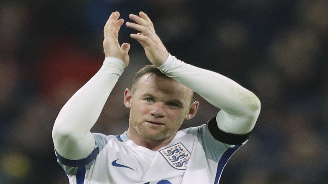 England's Wayne Rooney claps after winning the World Cup group F qualifying football match between England and Scotland with a 3-0 score at the Wembley stadium, London. (PHOTO: AP)