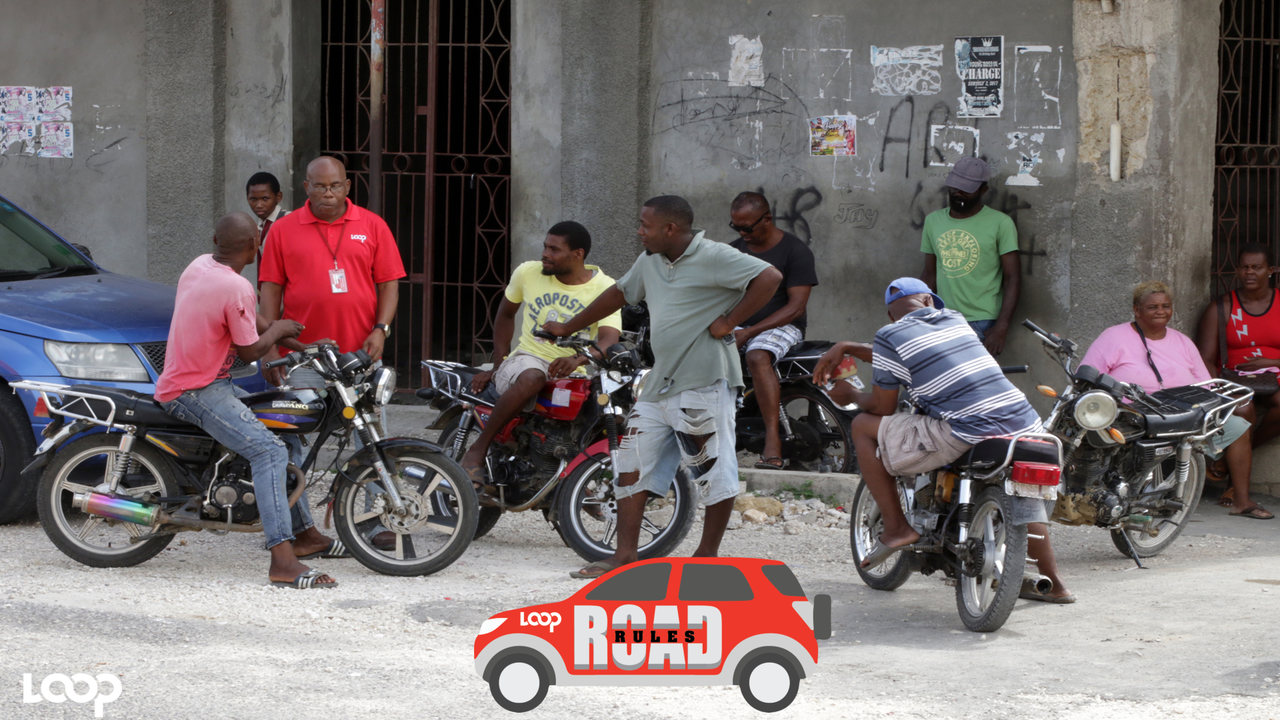 Loop News' Reginald Allen engages a group of motorcyclists in discussion in Little London, Westmoreland. (PHOTO & VIDEO: Ramon Lindsay)