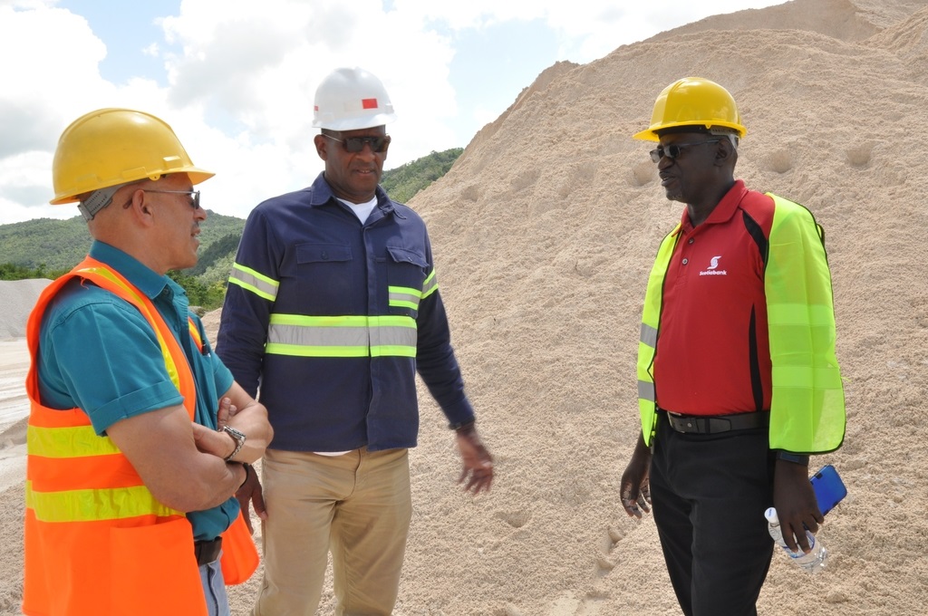 Eddie Cousins, Director of Lydford Mining and his Operations Director, Sam Millington, talk with Daniel Brown, Senior Manager of the mid-market segment of Scotiabank’s Corporate and Commercial Banking at the site of their mining operations in St Ann.