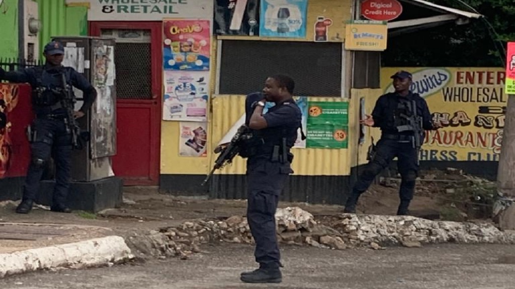 File photo of a heavily armed police team on patrol on Mountain View Avenue in Kingston recently.