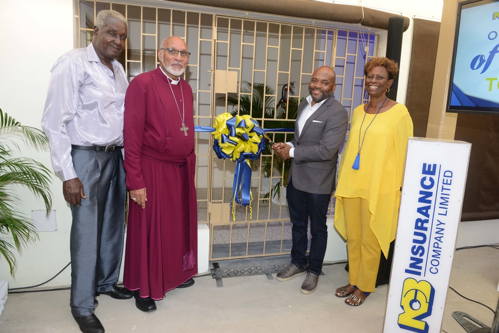 L-R: Rex Hartford James, Pensioner's Trustee; Reverend 
Howard Gregory, Archbishop of the West Indies, Primate & Metropolitan & Bishop of Jamaica and the Cayman Islands; Vernon James, CEO NCB Insurance Company; Audre Spence, NCB Pensioners Association & Centre Manager.