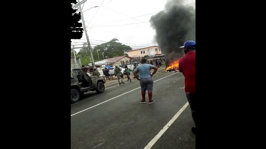 A screengrab from a  video showing members of the Jamaica Defence Force (JDF) at the scene of a protest over the fatal shooting of a man in Stewart Town, St Mary on Monday.