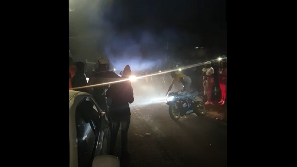 A screen grab from a video of a 'nine night' earlier this year, reportedly for a deceased cop in St Andrew, where extensive gun saluting took place.