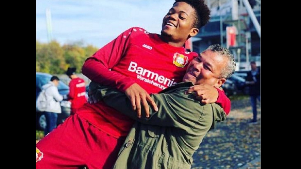 Jamaican football star Leon Bailey is pictured being embraced by his agent and adopted father Craig Butler in an undated photo posted to Instagram by Bailey on Thursday.