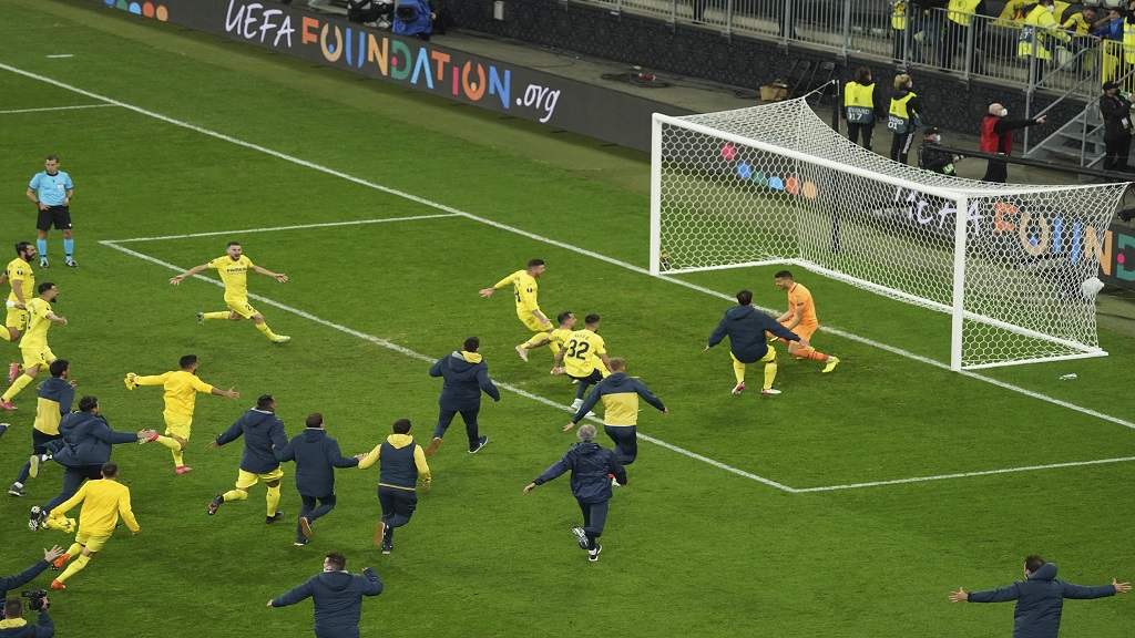 Villarreal players celebrate after winning from a penalty shoot-out at the Europa League final against Manchester United in Gdansk, Poland, Wednesday May 26, 2021. (Aleksandra Szmigiel, Pool via AP).