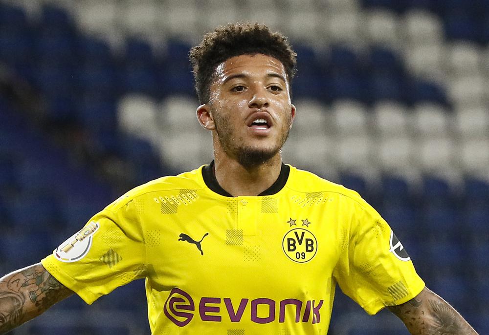 FILE - In this Monday, Sept. 14, 2020 file photo, Dortmund's Jadon Sancho plays during the 1st round German Soccer Cup match between MSV Duisburg and Borussia Dortmund in Duisburg, Germany. England winger Sancho has finalized his move to Manchester United by signing a five-year contract with the 13-time Premier League champions. (AP Photo/Martin Meissner, File)