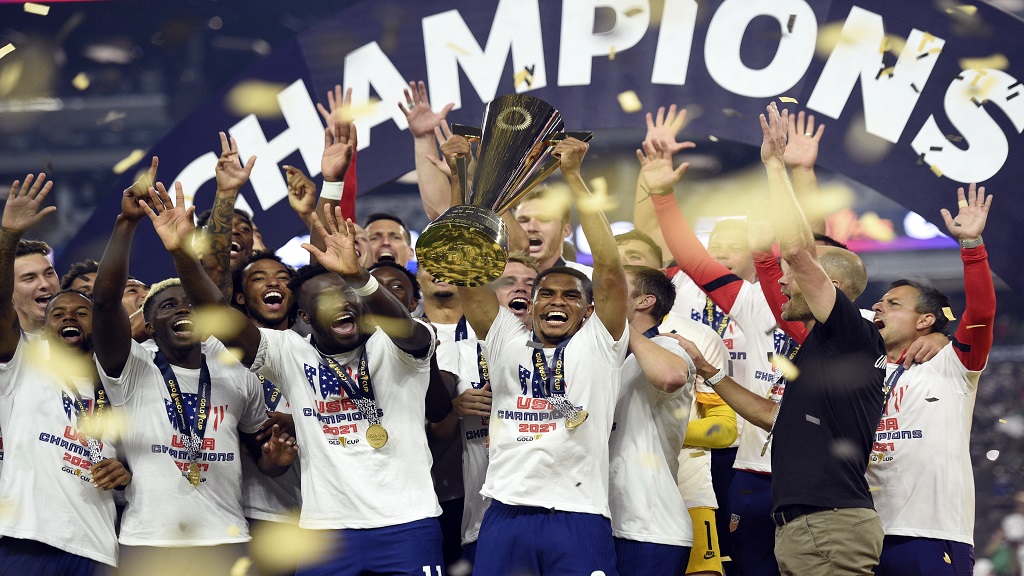 United States celebrate their extra-time victory over Mexico in the Concacaf Gold Cup final on Sunday, Aug. 1, 2021, in Las Vegas. (AP Photo/David Becker).