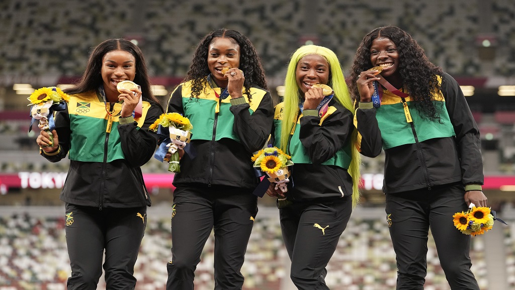 Gold medallists (from left) Briana Williams, Elaine Thompson-Herah, Shelly-Ann Fraser-Pryce and Shericka Jackson of Jamaica celebrate on the podium during the Victory Ceremony for the women's 4x100m relay event during the Tokyo 2020 Olympic Games at the Olympic Stadium in Tokyo on August 7, 2021. (AP photo)
