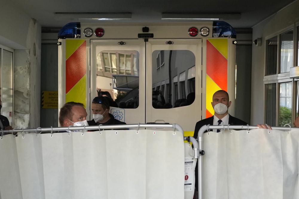 An ambulance carrying Czech Republic's President Milos Zeman arrives at the Military hospital in Prague, Czech Republic, Sunday, Oct. 10, 2021. Zeman is a heavy smoker who has suffered from diabetes and neuropathy linked to it. He has trouble walking and has been using a wheelchair. (AP Photo/Petr David Josek)