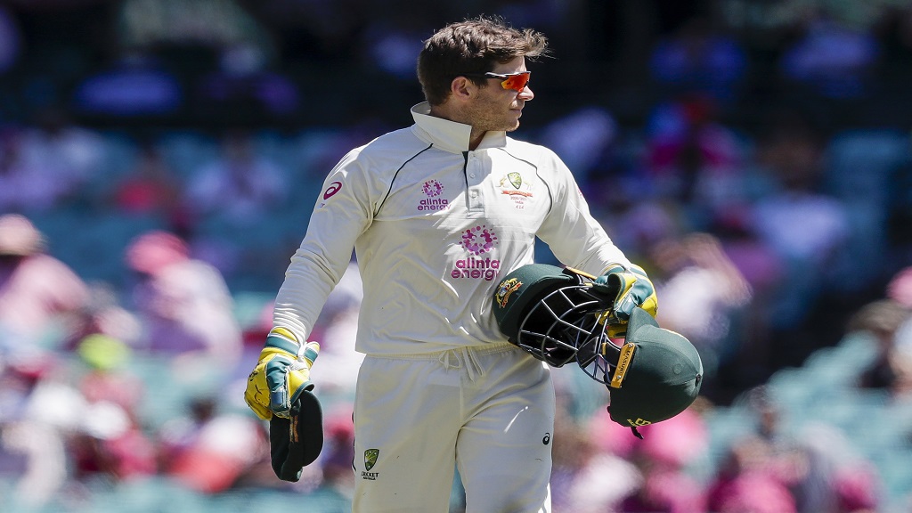 Australian captain Tim Paine walks to change ends during a cricket Test against India at the Sydney Cricket Ground, in Sydney, Australia on Jan. 9, 2021. Paine has quit as captain after admitting on Friday, Nov. 19, 2021, he sent explicit messages to a female co-worker. (AP Photo/Rick Rycroft, File)


