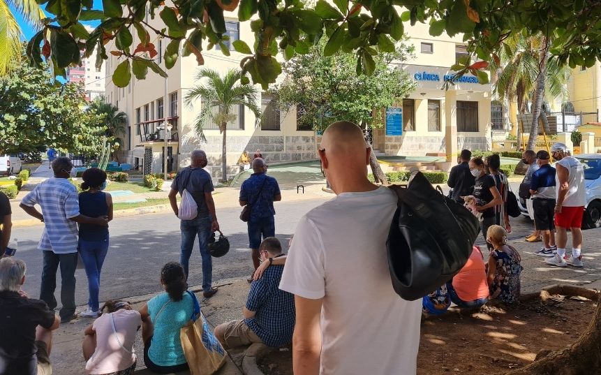 People waiting in "line" outside Clinica International in Havana, Cuba