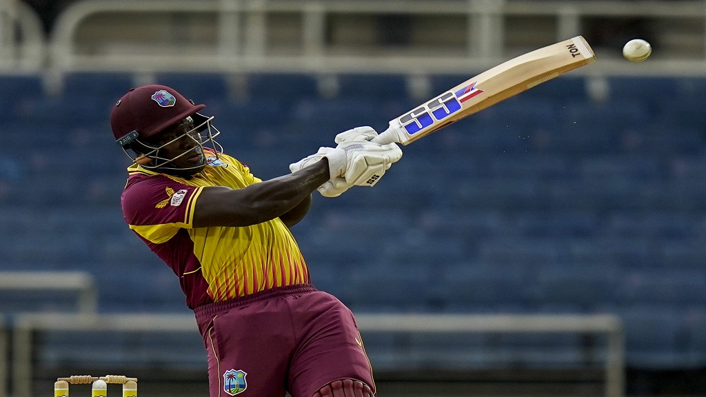 West Indies' Rovman Powell plays a shot against New Zealand during the second T20 cricket match at Sabina Park in Kingston, Jamaica, Friday, Aug. 12, 2022. (AP Photo/Ramon Espinosa).