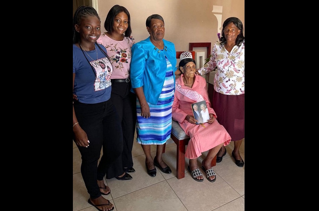 Turks and Caicos: Hadassa Smith (seated) is surrounded by loved ones as she marked a birthday milestone- she turned 100 years old on November 23, 2022. 