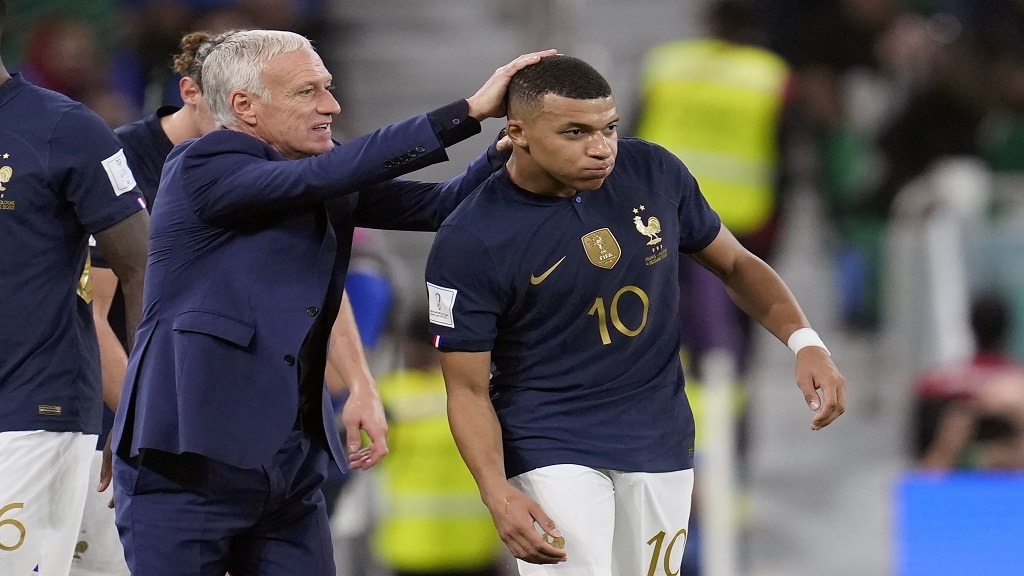 France's head coach Didier Deschamps, left, celebrates a goal by Kylian Mbappe, right, during the World Cup round of 16 football match against Poland, at the Al Thumama Stadium in Doha, Qatar, Sunday, Dec. 4, 2022. (AP Photo/Natacha Pisarenko).