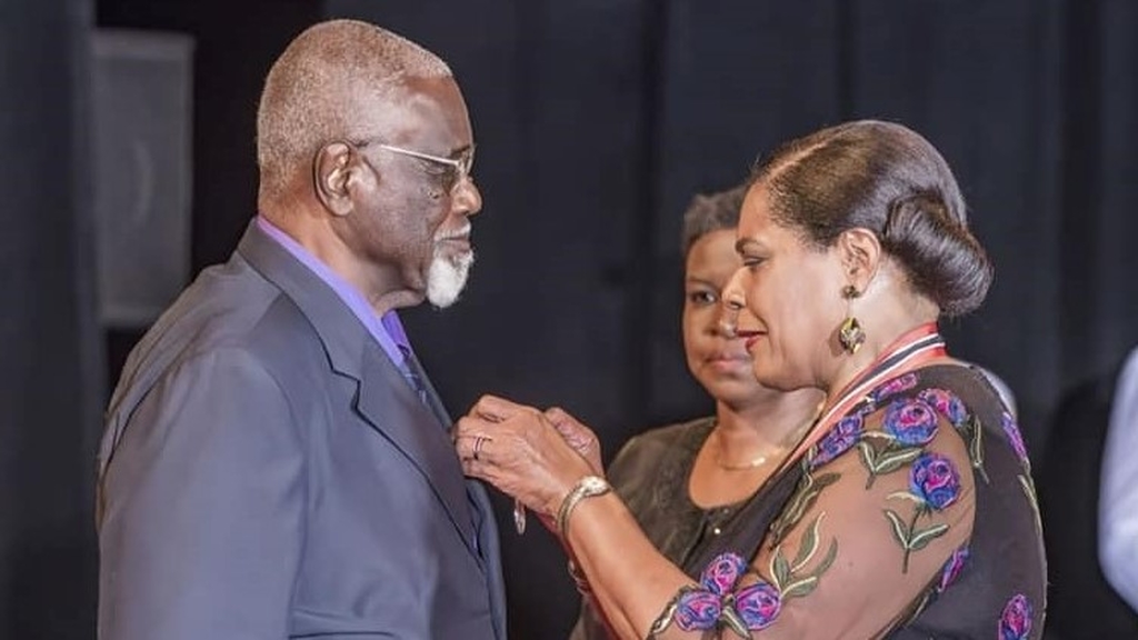 Professor Gordon Rohlehr received the Chaconia Medal, Silver, from President Paula Mae Weekes at the National Awards 2022. Photo: Office of the President.