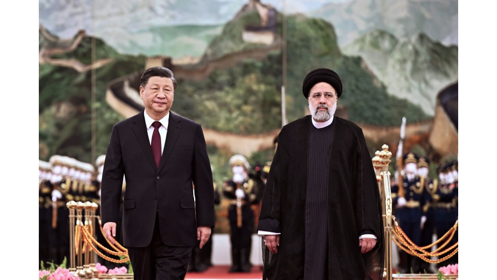 FILE - In this photo released by Xinhua News Agency, visiting Iranian President Ebrahim Raisi, right, walks with Chinese President Xi Jinping after reviewing an honour guard during a welcome ceremony at the Great Hall of the People in Beijing, Tuesday, February 14, 2023. (Yan Yan/Xinhua via AP, File)