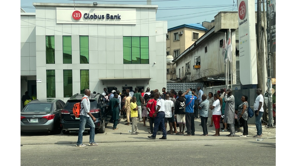 People queue to withdraw money from a cash machine outside a bank in Lagos, Nigeria, Tuesday, Feb. 7, 2023. (AP Photo/Dan Ikpoyi)