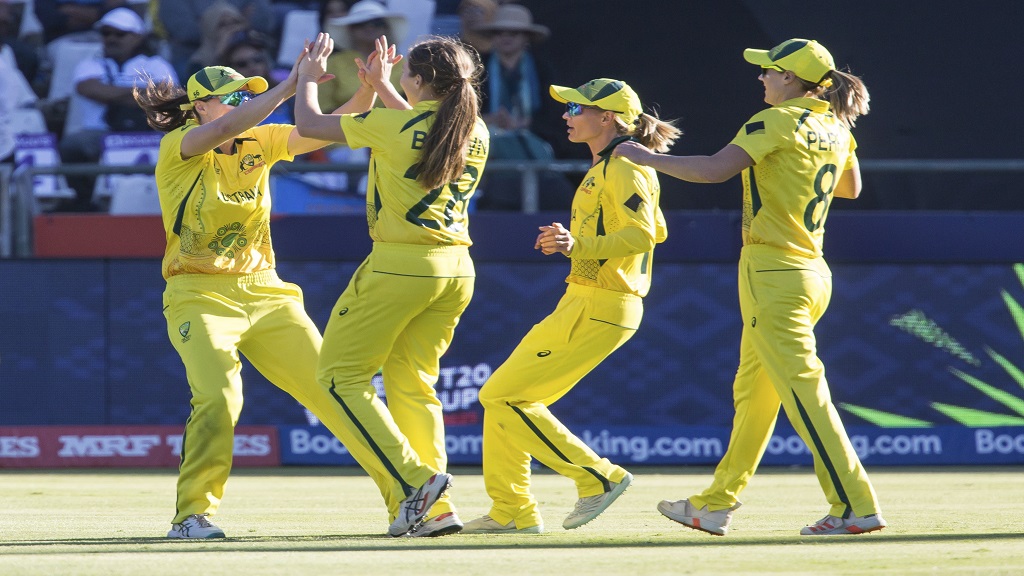Australia celebrate the wicket of India's Richa Ghosh during the Women's T20 World Cup semi final cricket match in Cape Town, South Africa, Thursday Feb. 23, 2023. (AP Photo/Halden Krog).

