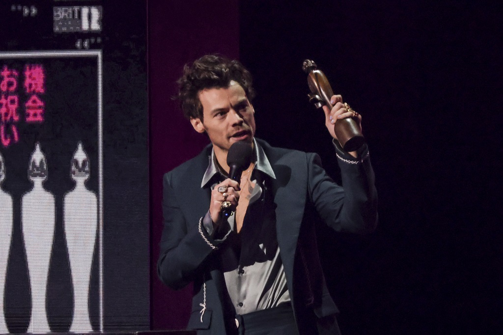 Harry Styles on stage accepting the award for Artist of the Year at the Brit Awards 2023 in London, Saturday, February 11, 2023. (Photo by Vianney Le Caer/Invision/AP)