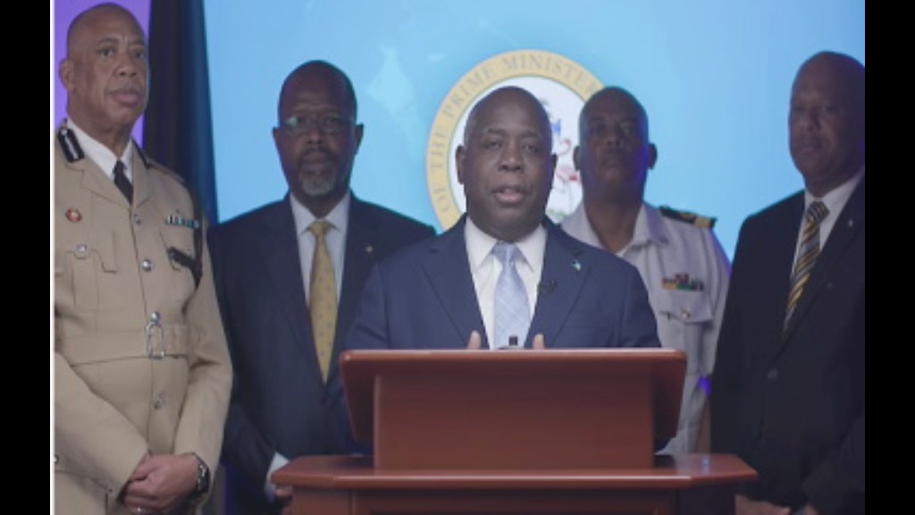 Prime Minister Philip Davis (centre) flanked by Commissioner of Police Clayton Fernander, Minister of National Security Wayne Munroe, Royal Bahamas Defence Force Commodore Raymond King and Immigration Minister Keith Bell., addressing the nation (CMC Photo) 