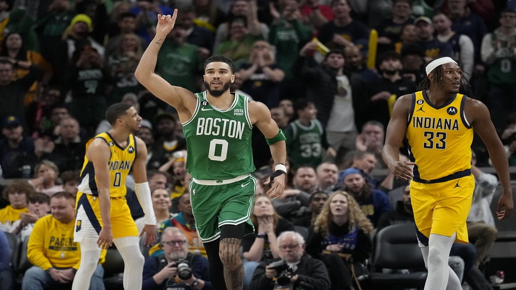 Boston Celtics forward Jayson Tatum (0) gestures after scoring in overtime of the team's NBA basketball game against the Indiana Pacers in Indianapolis, Thursday, Feb. 23, 2023. The Celtics won 142-138. (AP Photo/AJ Mast). 