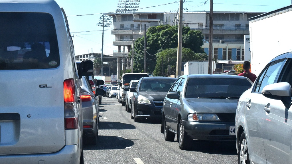 A motor vehicle build-up in the vicinity of the Corporate Area Traffic Court on Tuesday, as motorists with outstanding traffic fines sought to settle these ahead of the new Road Traffic Act coming into effect February 1.  (Photo: JIS)