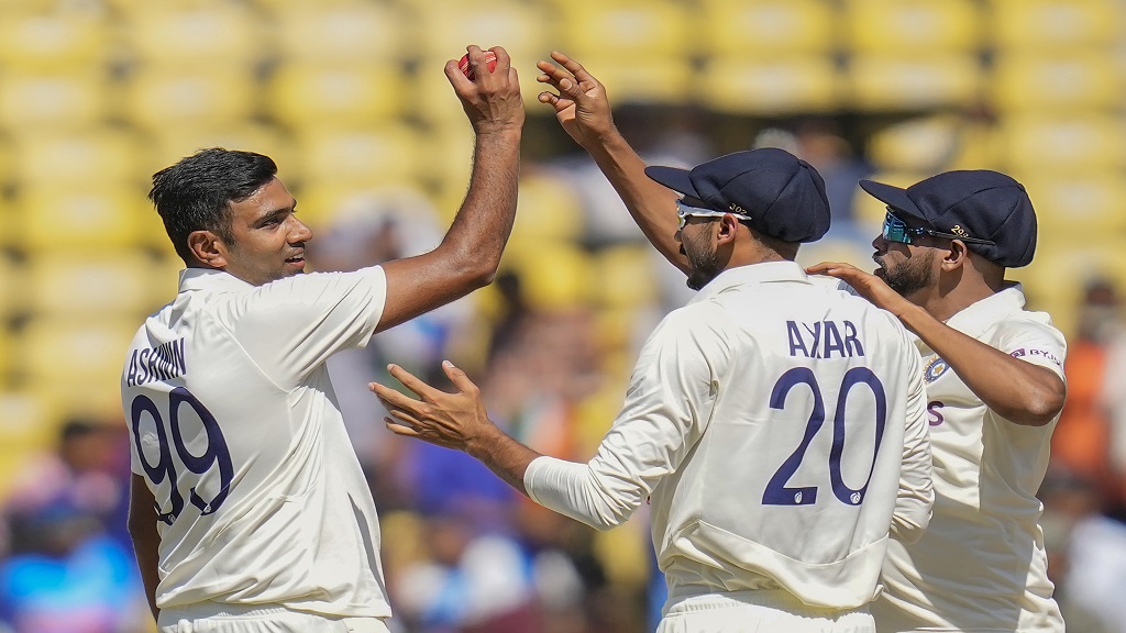 India's Ravichandran Ashwin, left, celebrates his five-wicket haul with his teammates after the dismissal of Australia's Alex Carey during the third day of the first cricket test match in Nagpur, India, Saturday, Feb. 11, 2023. (AP Photo/Rafiq Maqbool).