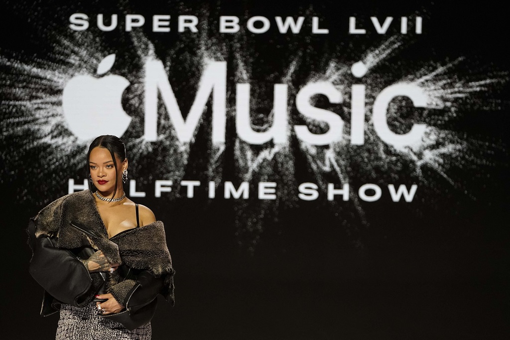 Rihanna poses for a photo after a halftime show news conference ahead of the Super Bowl 57 NFL football game, Thursday, February 9, 2023, in Phoenix. (AP Photo/Mike Stewart)