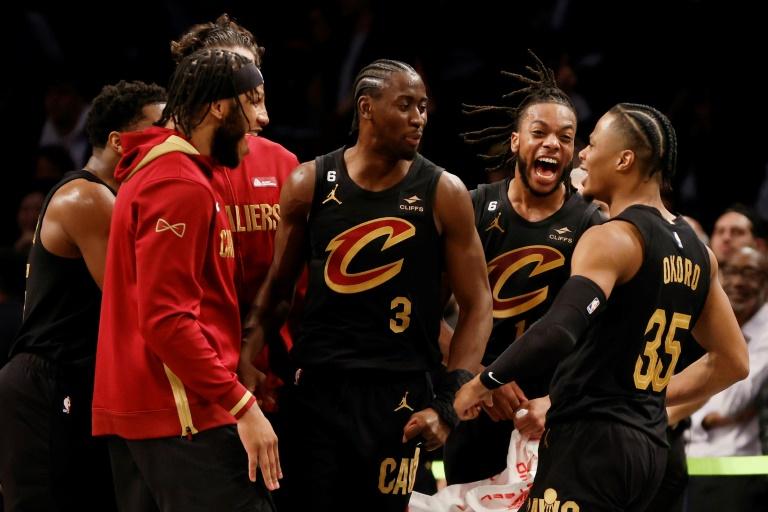 Isaac Okoro (N.35) congratulated by his family after scoring the basket in the Cleveland Cavaliers' victory against the Brooklyn Nets in the NBA on March 23, 2023 in Brooklyn  