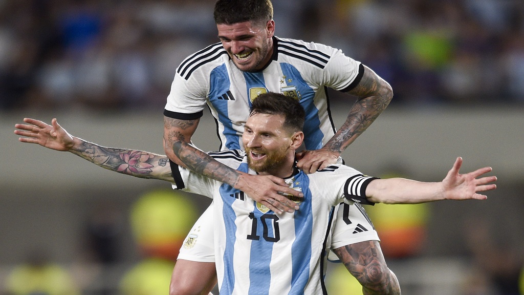 Argentina's Lionel Messi celebrates with teammate Rodrigo De Paul scoring his side's second goal against Panama during an international friendly soccer match in Buenos Aires, Argentina, Thursday, March 23, 2023. (AP Photo/Gustavo Garello).
