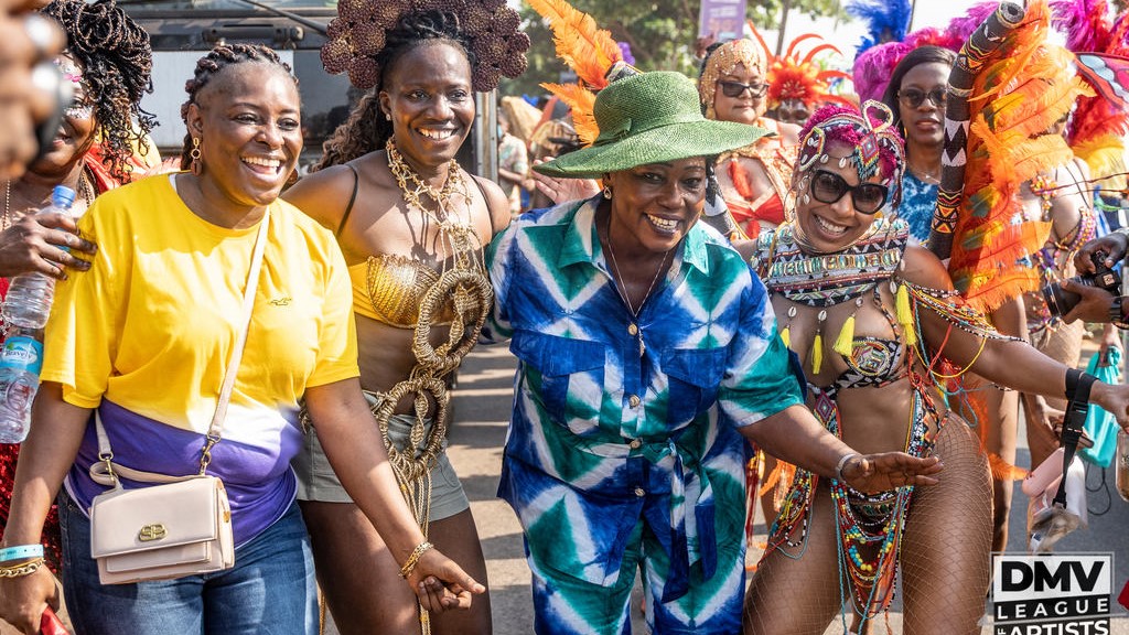 Sierra Leone's Minister Of Tourism Memunatu Pratt surrounded by Masqueraders.JPG - Photo provided by DMV League of Artist