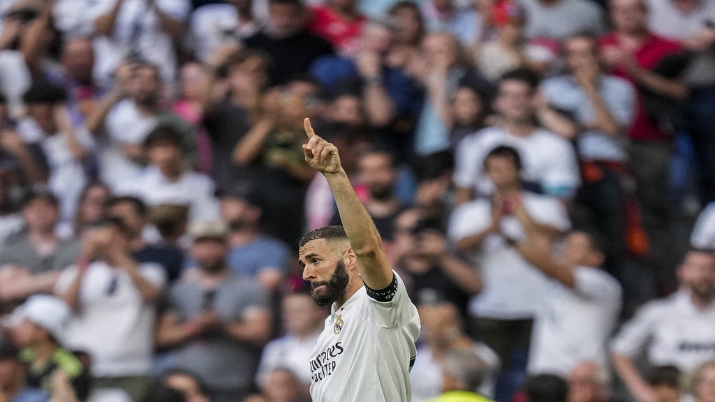 Real Madrid's Karim Benzema celebrates after scoring during the Spanish La Liga football match against Athletic Bilbao at the Santiago Bernabeu stadium in Madrid, Sunday, June 4, 2023. (AP Photo/Bernat Armangue).