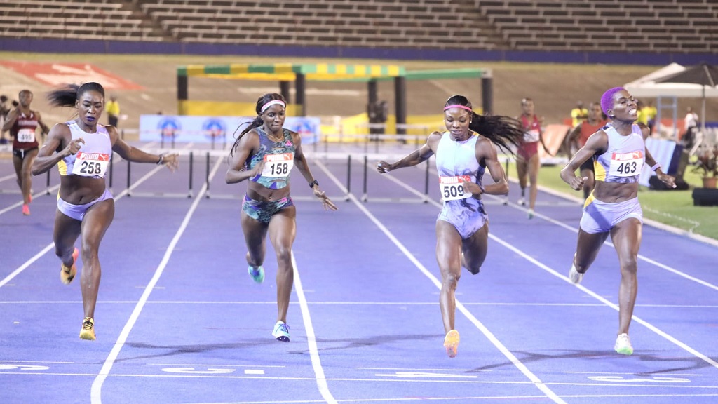 Janieve Russell (right) wins the women's 400m hurdles on day two of the National Senior and Junior Championships at the National Stadium on Friday, July 7, 2023. (PHOTO: Marlon Reid).