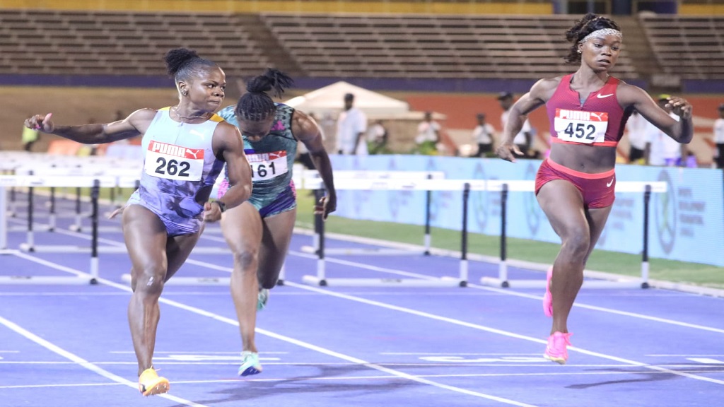 Megan Tapper (left) wins semi-final two of the women's 100m hurdles on the third and penultimate day of the National Senior and Junior Championships at the National Stadium on Saturday, July 8, 2023. (PHOTO: Marlon Reid).