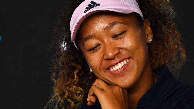 Naomi Osaka was all smiles. (Photo by PAUL CROCK/AFP/Getty Images)
