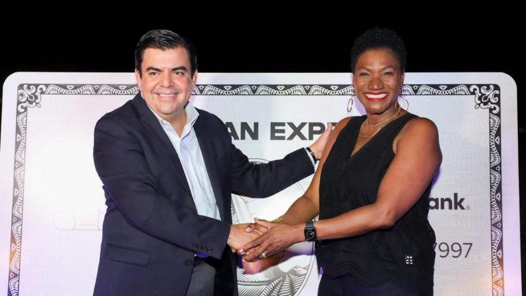 Audrey Tugwell Henry(left), President and CEO of Scotia Group Jamaica greets Mario Luna ( right), American Express, Regional Vice President Latin America & Caribbean - Global Network Partnerships at the launch of the The Platinum Card® from Scotiabank hosted at the Caymanas Polo Club on July 30.