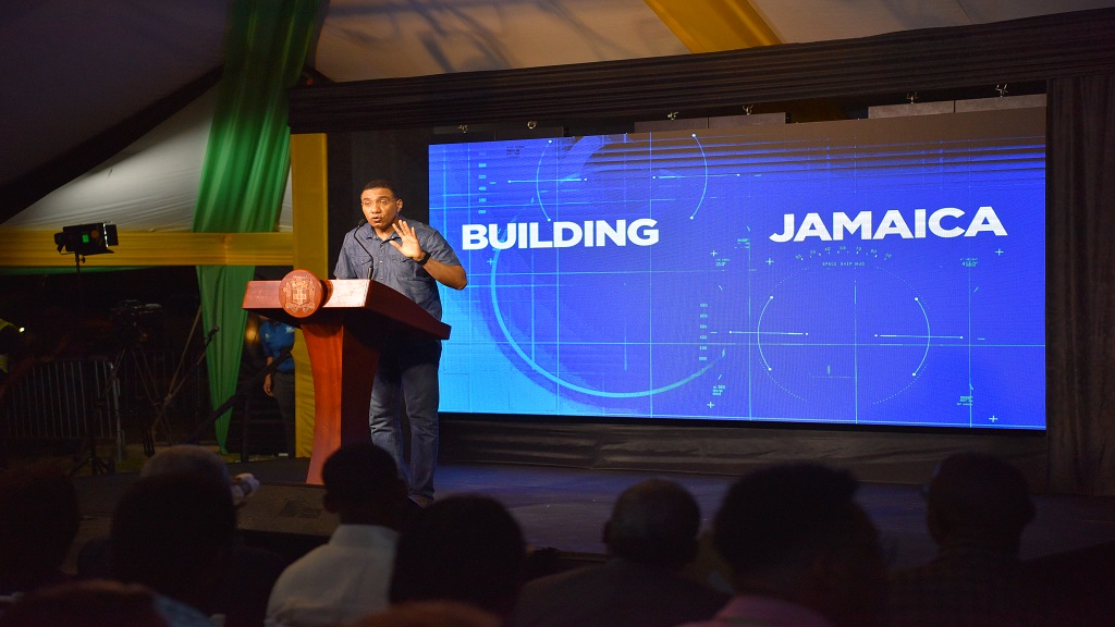 Prime Minister Andrew Holness addresses a town hall meeting at Harmony Beach Park in Montego Bay, St James on Thursday. (Photos: JIS)