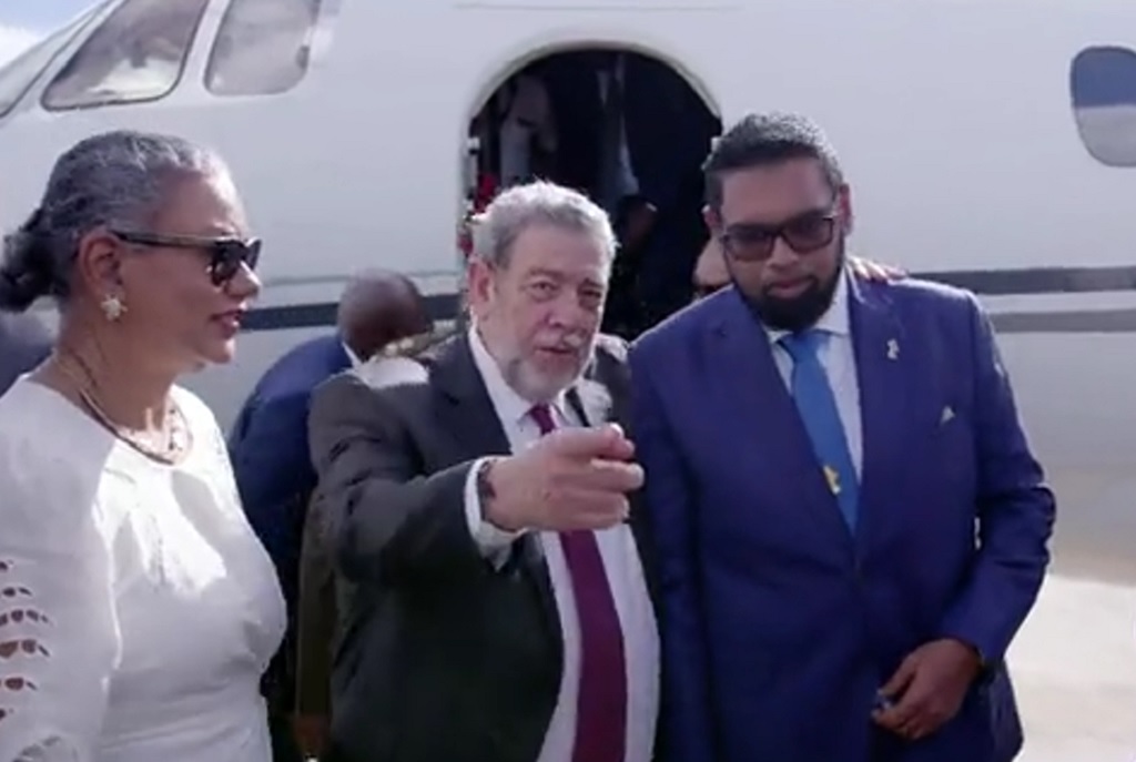 Prime Minister of St Vincent and the Grenadines Dr Ralph Gonsalves welcomes the President of Guyana Dr Irfaan Ali at the Argyle International Airport on December 14, 2023, where a high level dialogue will take place between Guyana and Venezuela. 