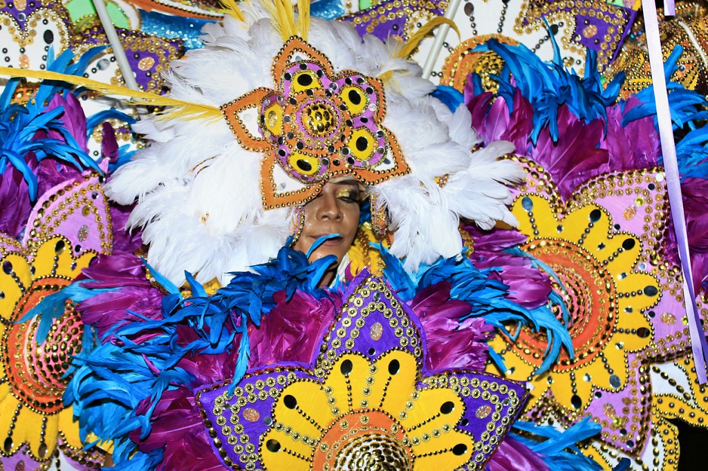 Nassau, Bahamas – December 26, 2022: A woman in a traditional costume during a Junkanoo parade in the Bahamas. (Photo credit: Wirestock)