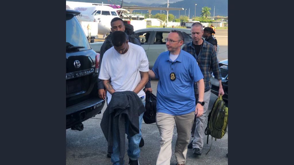 US Marshals and agents from the US Department of State Diplomatic Security Service on December 13, 2023, escort Kim Maharaj at the Piarco airport for his extradition to the United States for a 1998 gang assault crime. 
