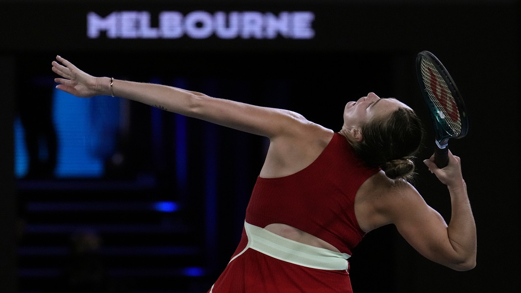 Aryna Sabalenka of Belarus serves to Coco Gauff of the U.S. during their semifinal match at the Australian Open tennis championships at Melbourne Park, Melbourne, Australia, Thursday, Jan. 25, 2024. (AP Photo/Andy Wong).