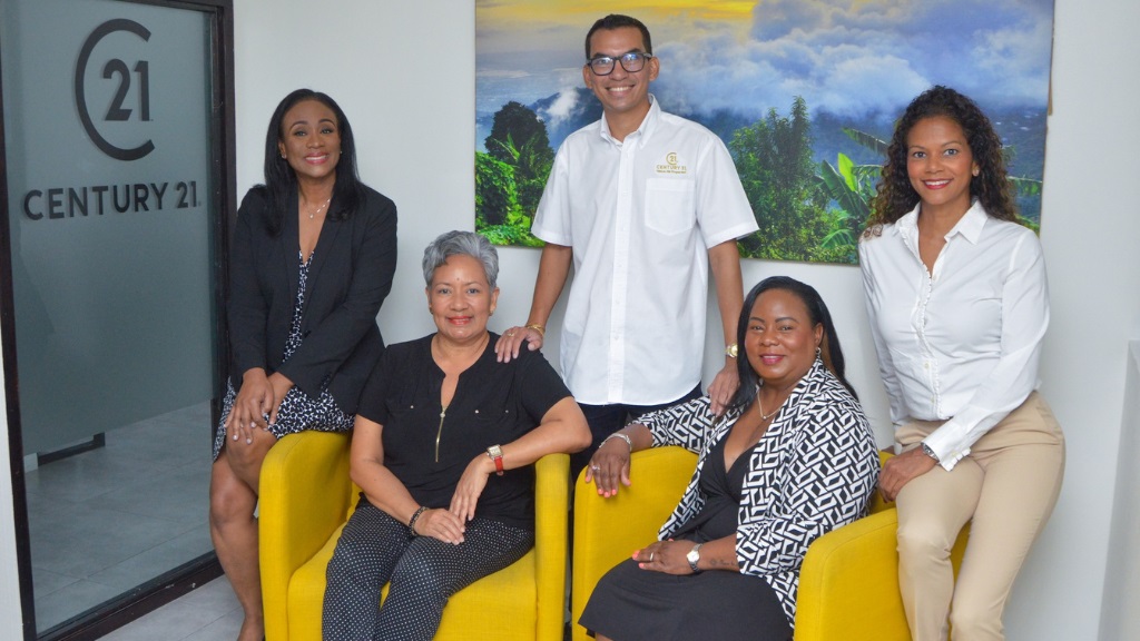 Front row - left to right: Andrea Sweeney, Business Development Consultant; Elizabeth Tavares-Oliver, Realtor Associate; Collet Kirkcaldy, General Manager; and Gillian Zacca, Realtor Associate, unite during a Century 21 activation event recently. Standing in the back row is Jordan Chin, Executive Chairman for Century 21 Jamaica.
