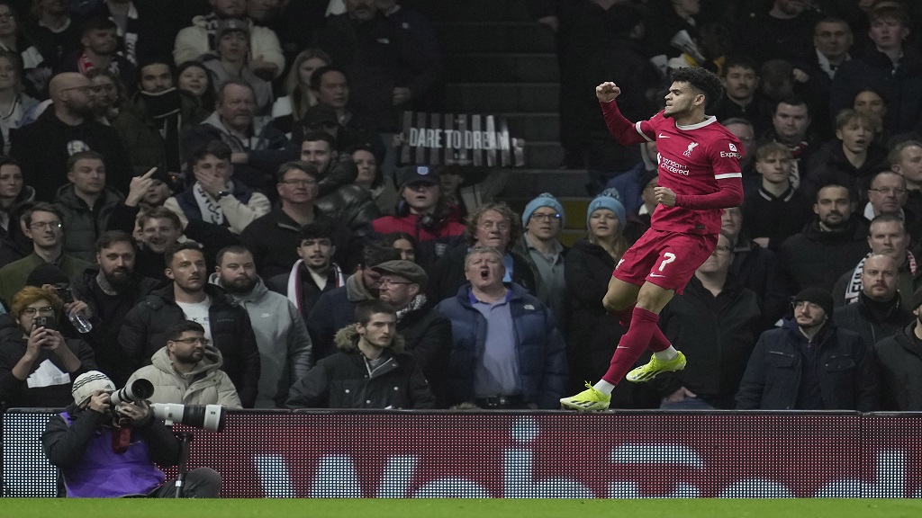 Liverpool's Luis Diaz celebrates after scoring against Fulham during the English League Cup semi final second leg football match at Craven Cottage stadium in London, England, Wednesday, Jan. 24, 2024. (AP Photo/Kin Cheung).

