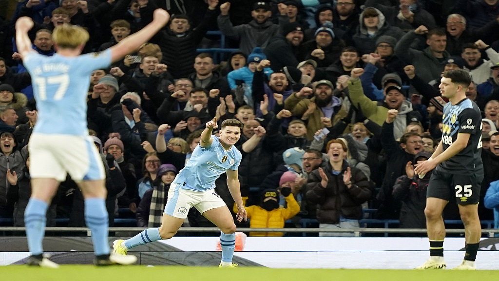 Manchester City's Julian Alvarez celebrates after scoring his side's second goal during the English Premier League match against Burnley at the Etihad Stadium in Manchester, Wednesday, Jan. 31, 2024.(AP Photo/Dave Thompson).