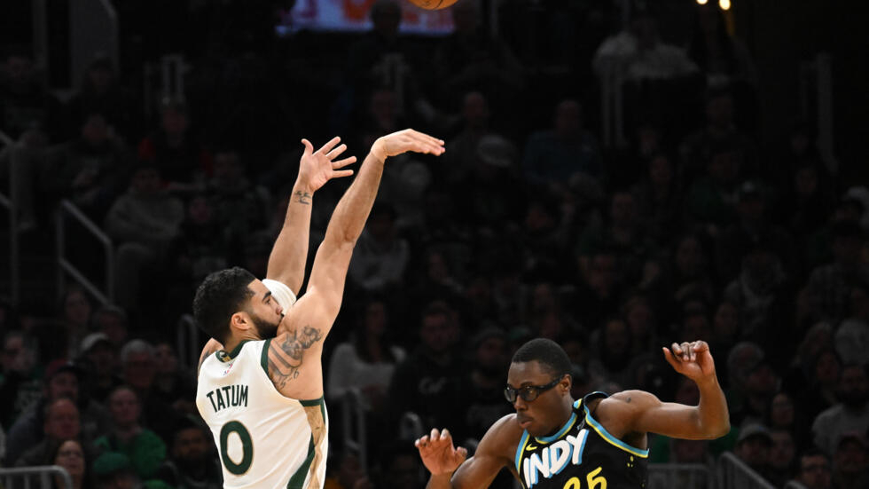 Boston Celtics star Jayson Tatum attempts a three-point shot during an NBA game against the Indiana Pacers, in Boston, January 30, 2024 BRIAN FLUHARTY / GETTY IMAGES NORTH AMERICA/AFP  