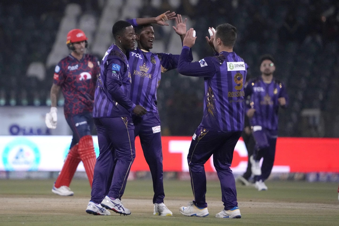 Quetta Gladiators’ Akeal Hosein, third left, celebrates with teammates after taking the wicket of Islamabad United’ Alex Hales during the Pakistan Super League T20 cricket match between Islamabad United and Quetta Gladiators, in Lahore, Pakistan Thursday, Feb. 22, 2024. (AP Photo/K.M. Chaudary)