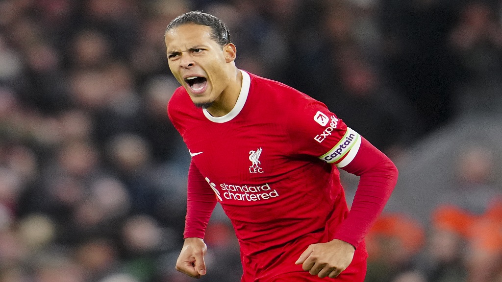 Liverpool's Virgil van Dijk celebrates after scoring his side's first goal during the English Premier League football match against Luton Town, at Anfield stadium in Liverpool, England, Wednesday, Feb. 21, 2024. (AP Photo/Jon Super).


