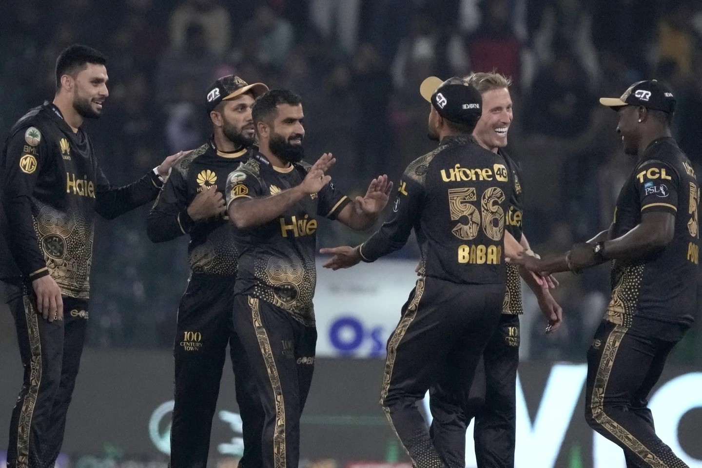 Peshawar Zalmi’ Arif Yaqoob, thrid left, celebrates with teammates after taking the wicket during the Pakistan Super League T20 cricket match between Peshawar Zalmi and Islamabad United, in Lahore, Pakistan, Monday, Feb. 26, 2024. (AP Photo/K.M. Chaudary)