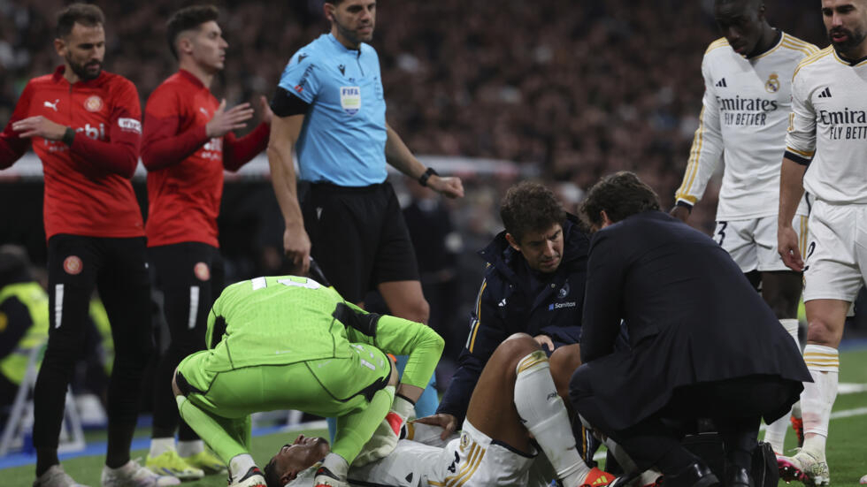 Real Madrid star striker Jude Bellingham (on the ground) was injured during the La Liga match against Girona at the Santiago Bernabeu stadium in Madrid on Saturday.  PIERRE-PHILIPPE MARCOU / AFP  
