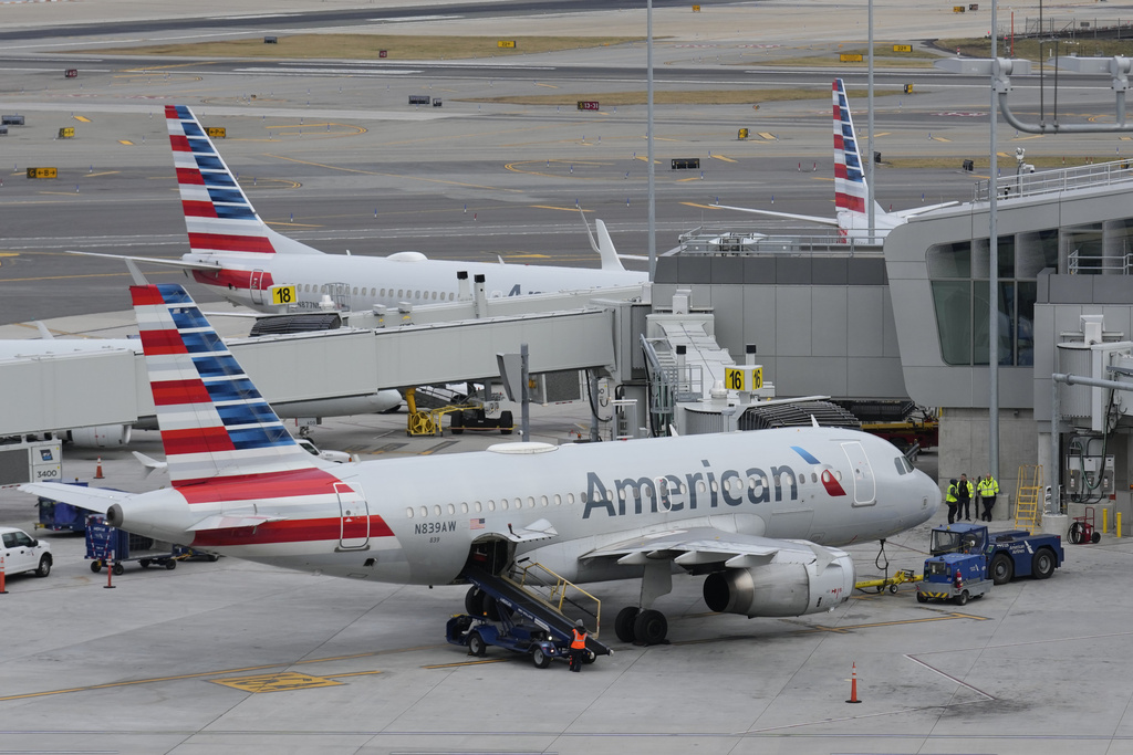 FILE - American Airlines planes sit on the tarmac at Terminal B at LaGuardia Airport, January 11, 2023, in New York. (AP Photo/Seth Wenig, File)